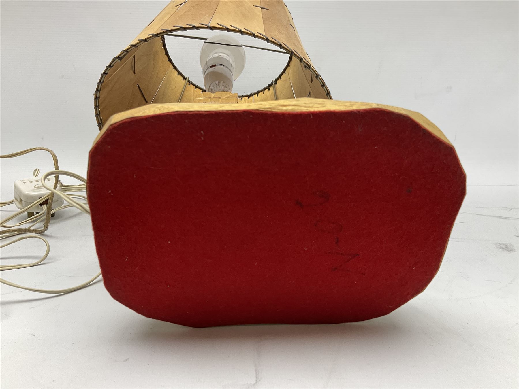 Mid 20th century Paul Caron carved table lamp, modelled as man standing before an oven, the chimney supporting the panelled shade, the base signed P.E. Caron, H42cm