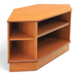 G-Plan - teak corner media unit, shaped top above a sliding central shelf above an open recess, flanked by further shelves, raised on a plinth base with a rear aperture for wires