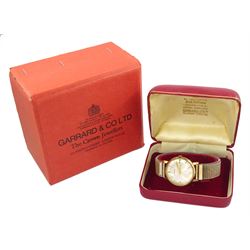 Gerrard gentleman's 9ct gold manual wind wristwatch, silvered dial with baton hour markers, London 1972, on expanding gilt strap, boxed