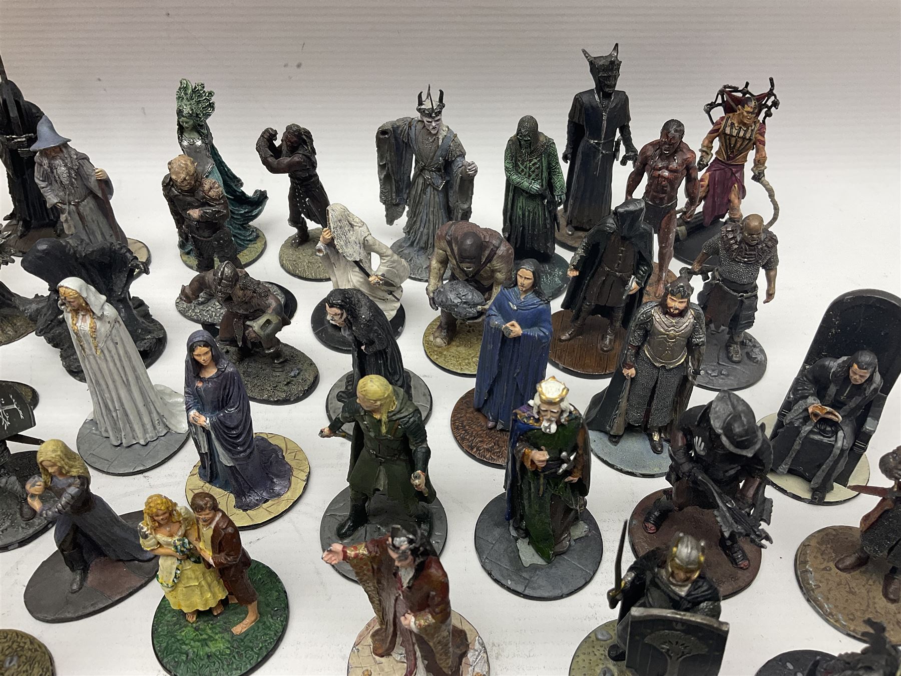 Approximately 80 NLP Lord of the Rings heavy metal painted figurines to include Fell Beast, boxed, and The Watcher, The Dark Lord Sauron, Treebeard etc, and unassociated Dracula themed composite figures marked HHFT50 