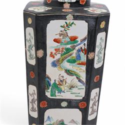 Chinese square section vase with canted corners decorated with panels of figures and landscapes on a black ground circa 1900 H51cm