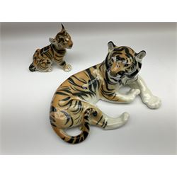 USSR figure of a large recumbent tiger together with a seated tiger cub figure, both stamped USSR beneath, largest L30cm