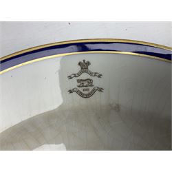 Collection of Regimental dinner wares, Comprising Royal Sussex; two dinner plates, two side plates and a soup bowl, Royal Leicestershire; two dinner plates, East Yorkshire Regiment side plate and Gordon Highlanders side plate, all decorated with the regiment's crests and blue and gilt boarders (9)
