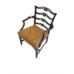 George III mahogany elbow chair, ladder back with pierced and shaped slats carved with scrolls, seat upholstered in tan leather with studwork, scrolled arm terminal raised on chamfered supports joined by stretchers with brass castors