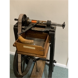 Lightwood's treadle operated Improved Ball Bearing Cartridge Turnover Lathe for pinfire and centre fire shotgun cartridges, late 19th century, with iron frame, elm footplate and removable tray box with attachments and wrench, photocopy of contemporary advertisement, H104cm W59cm