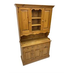 Pine farmhouse dresser, raised back with two cupboards flanking open shelves, above three drawers and three cupboards