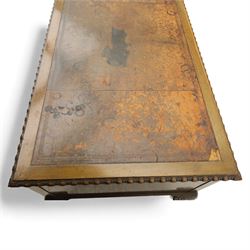 Waring & Gillow - Early 20th century mahogany desk, the leather-inset top above a shaped kneehole, central compartmented frieze drawer flanked by twin banks of of three drawers, each with brass handles, raised on cabriole legs with carved ball and claw feet (Height from floor to underside 62cm)