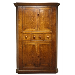  Large 18th century oak corner cabinet, with four fielded panelled doors, three centre drawers, with turned wooden handles, on plinth base, W135cm, H204cm  