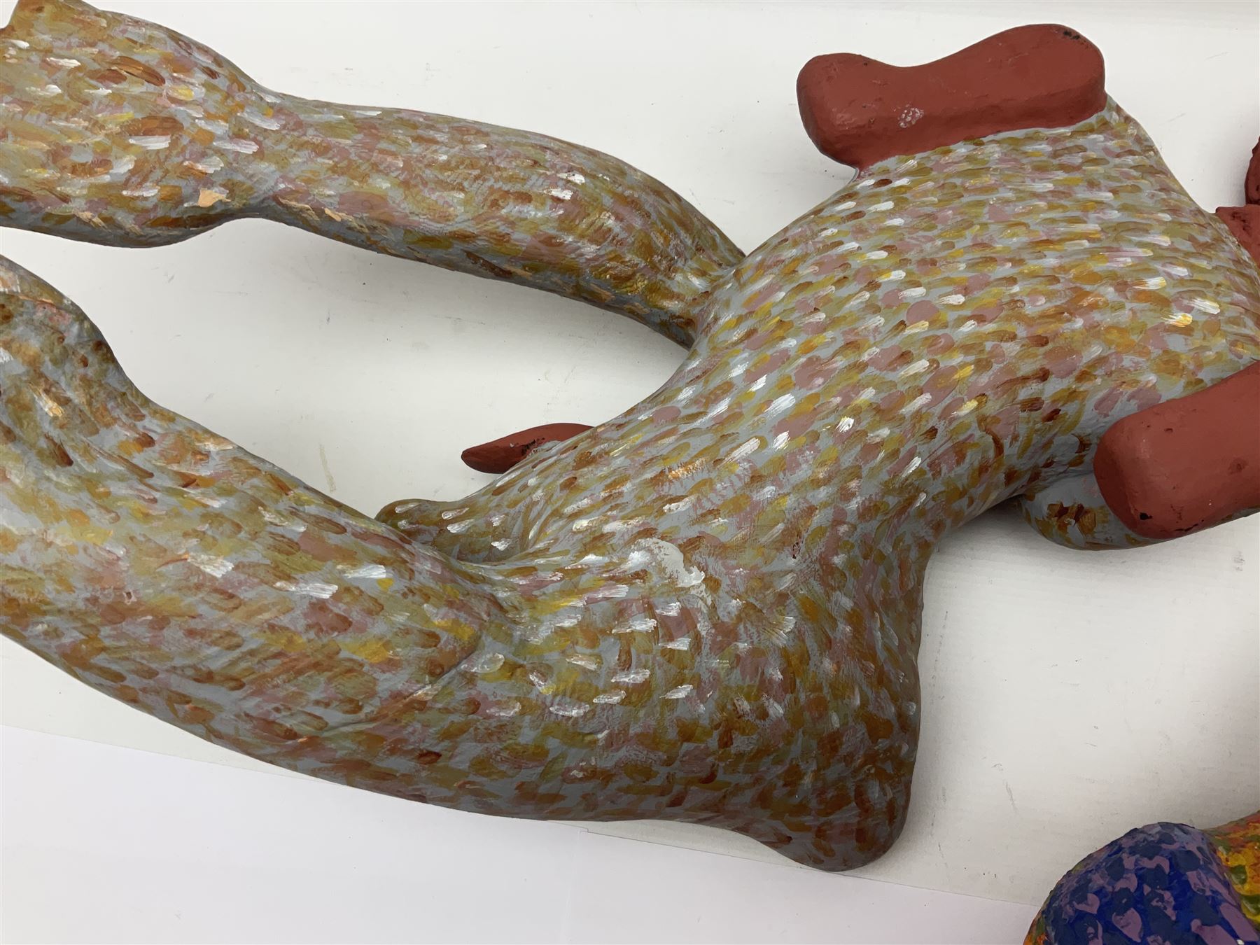 Helen Skelton (British 1933 – 2023): Two carved wooden abstract sculptures, one modelled as a dog, the other modelled as a bear, both with painted stippled decoration, largest H20cm. Born into an RAF family in 1933 in Kent and travelled the world extensively during her childhood. After settling in Bridlington, Helen immersed herself in painting, textiles, and wood sculpture, often inspired by nature's beauty. Her talent was showcased in a one-woman show at Sewerby Hall and recognised with the sculpture prize at Ferens Art Gallery in 2000. Sadly, Helen’s daughter passed away from cancer in 2005. This loss inspired Helen to donate her sculptures to Marie Curie upon her passing in 2023.