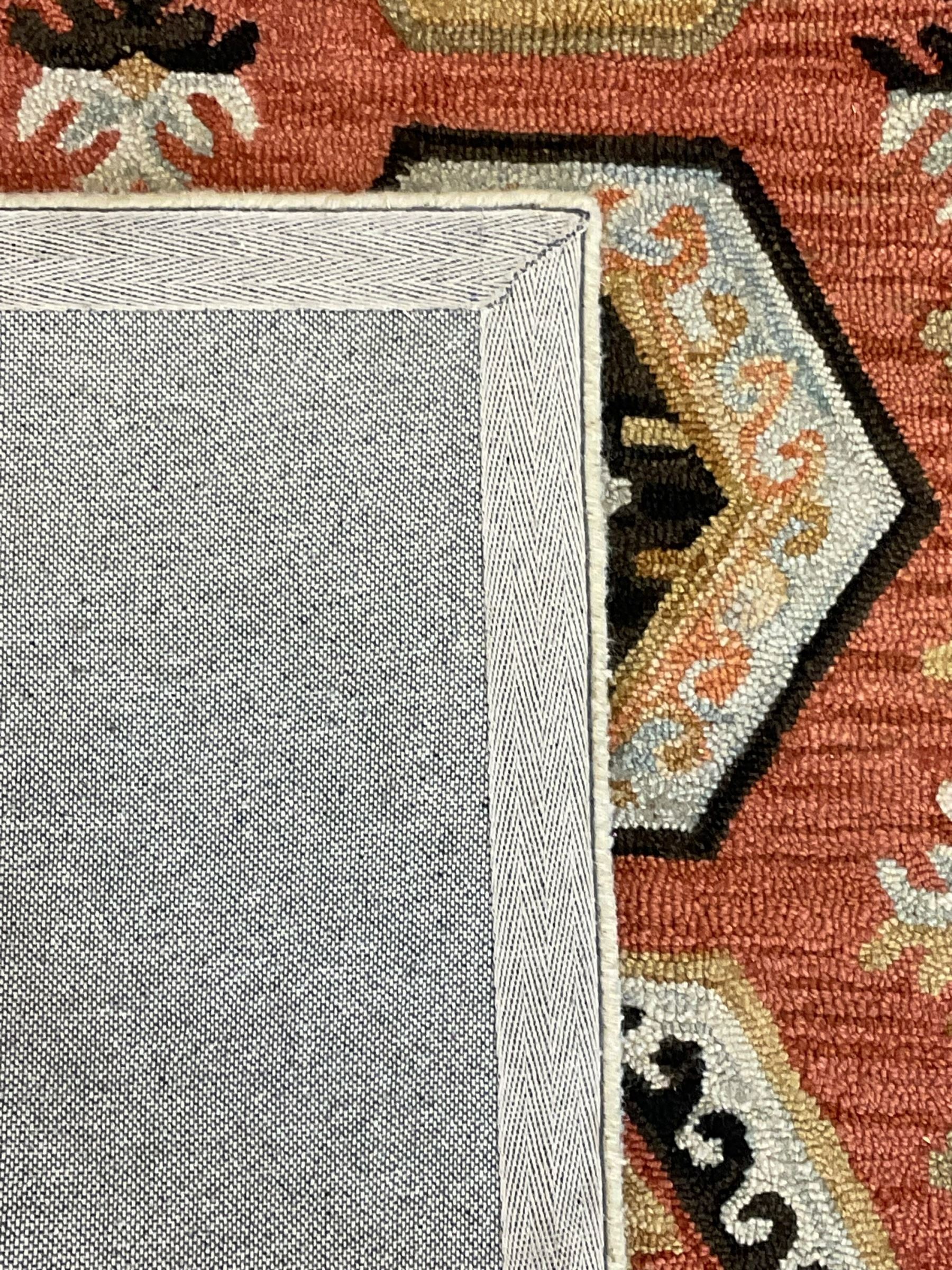 OKA - Turkish design peach ground rug, the field decorated ejder motifs within hooked and geometric design borders 