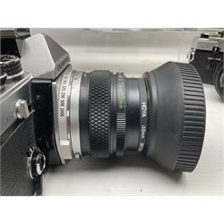 Four Olympus camera bodies, including Olympus OM10, serial no 20744269, with 'Olympus OM-System Zuiko Auto-S 50mm 1:1.8' lens serial no 3633644, Olympus OM-2 camera body serial no 460280 with 'Olympus OM-System G.Zuiko Auto-s 1:1.4 f=50mm' lens, serial no 729750, etc 