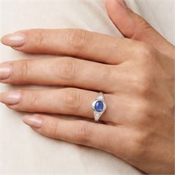 Platinum sapphire and diamond three stone ring, single cabochon sapphire of 1.65 carat, with a rubover set old cut diamond set either side, stamped 850 Plat, total diamond weight 0.42 carat