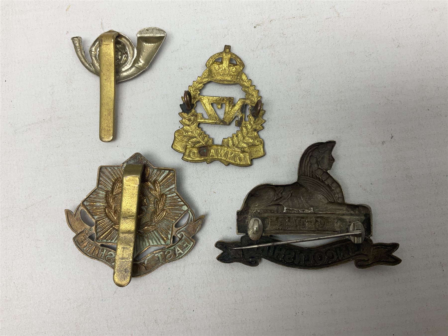 South African Army Orange Free State Artillery badge; three Commonwealth badges; and twelve Yorkshire/Lincolnshire badges including East Yorkshire, West Riding, York and Lancaster, West Yorkshire etc (16)