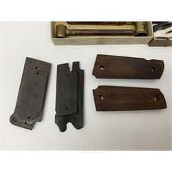 Six pairs of revolver grips;  pair of Lightwood & Son Ltd powder/shot measures in original box; and boxed Colt hammer shroud 