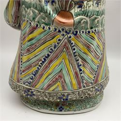 Chinese Republic Period porcelain figure, modelled as Shoulao, wearing elaborately enamelled robes decorated with peaches and flower heads, with impressed mark beneath, H55cm