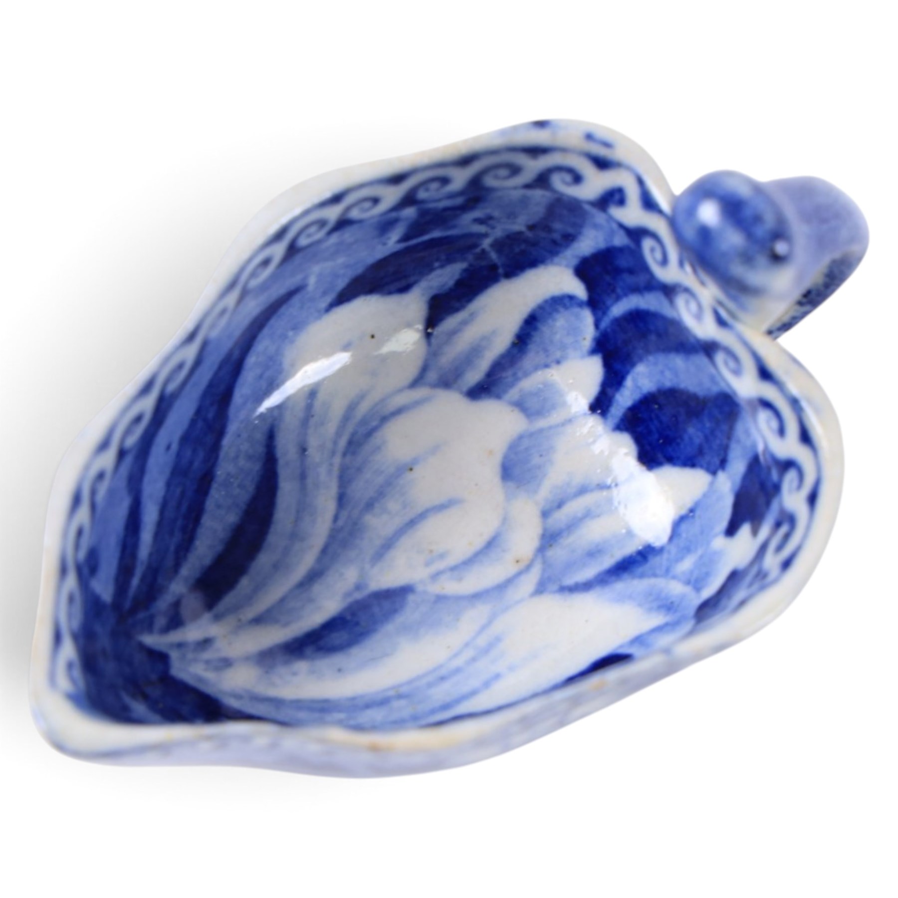 Early 19th century Spode butter boat, of leaf shaped form with high curved open handle, transfer printed with flowers, H5cm L8cm
