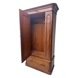 Large Victorian mahogany wardrobe, projecting moulded cornice over single panelled door enclosing hanging hooks and sliding rail, the base fitted with full width drawer, on plinth base


