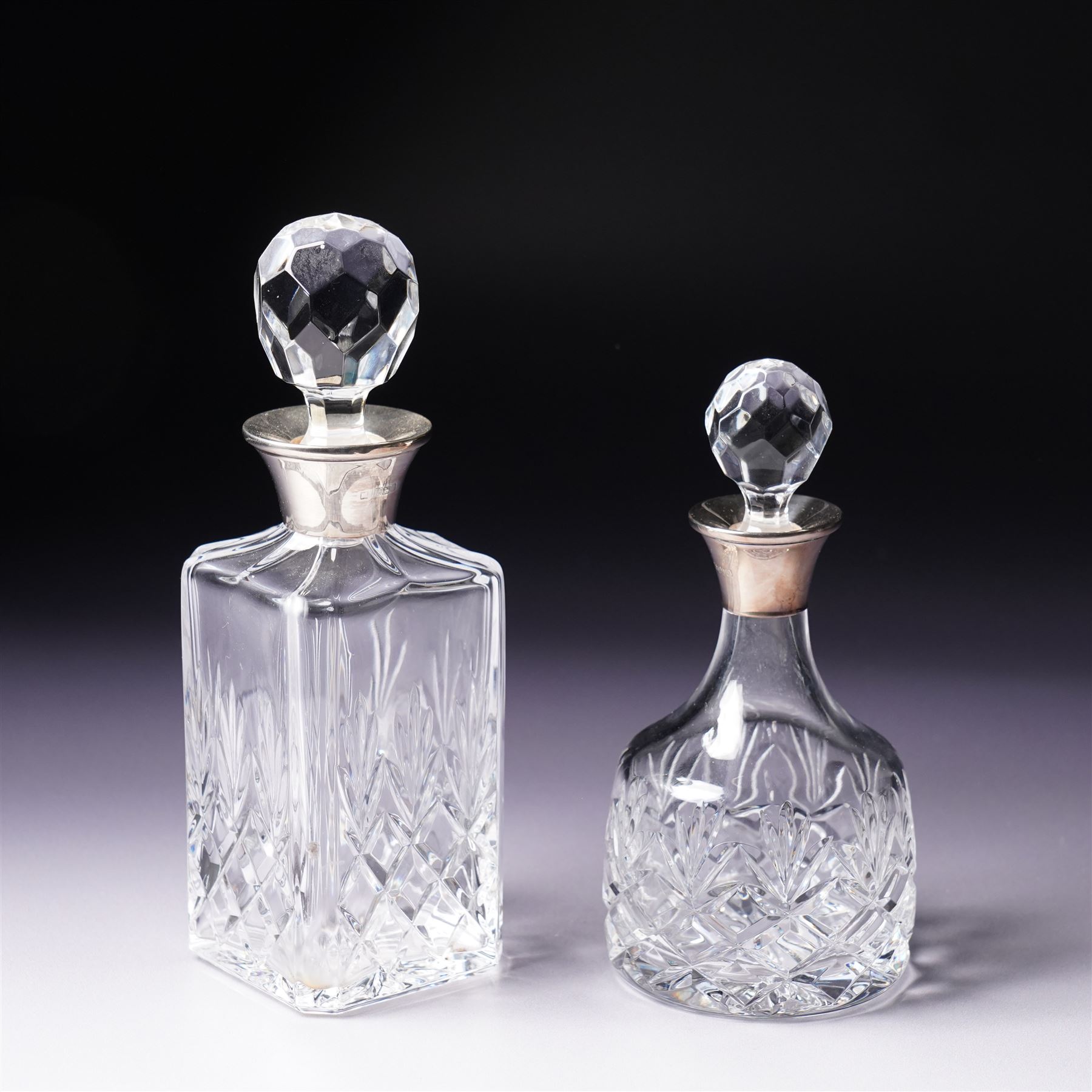 Square glass scent flask with silver collar and facet cut stopper Birmingham 1990, another and a glass claret jug with plated mounts