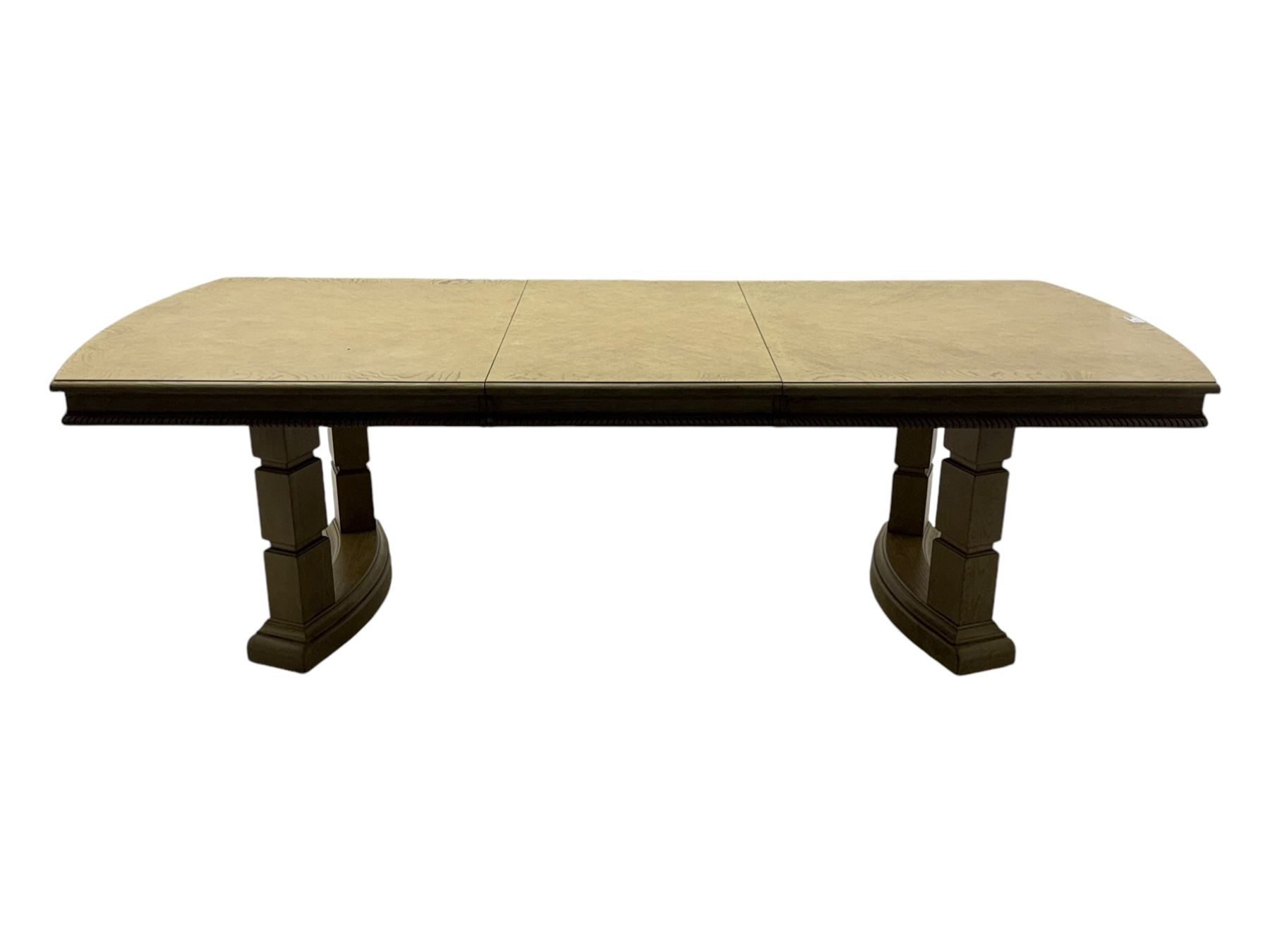 Brunswick - washed oak finish extending dining table, rectangular top with curved ends and carved frieze, central extension leaf, raised on twin pedestals with arched plinth bases and square-sectioned column supports; set of eight (6+2) high-back dining chairs upholstered in beige velvet fabric