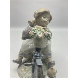Lladro figure, In No Hurry, modelled as a girl on a tricycle, sculpted by Francisco Polope, with original box, no 5679, year issued 1990, year retired 1994, H15cm
