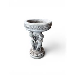 Cast stone cherub bird bath, circular removable top raised on three cherubs with ornate detailing