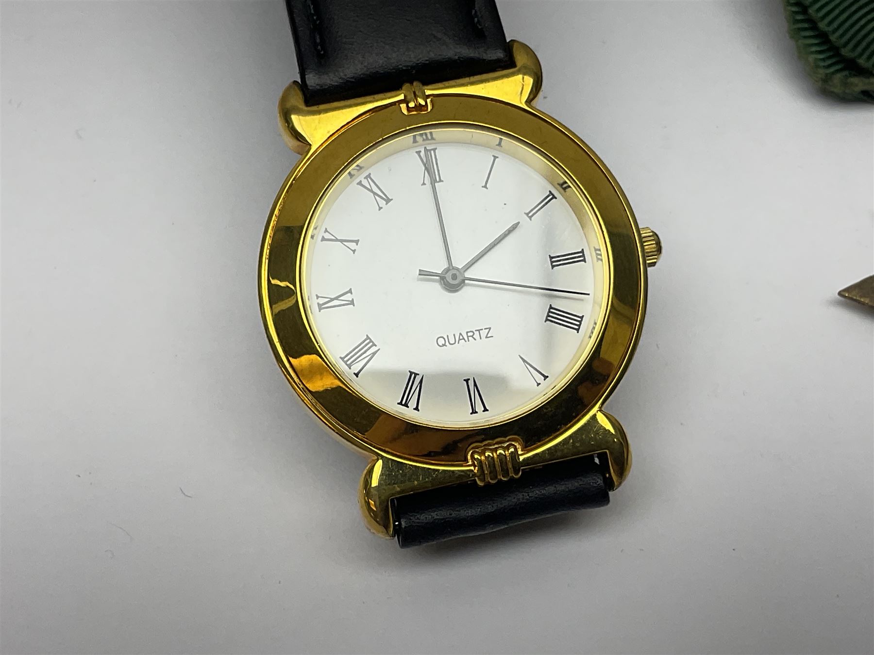 Ladies Accurist 9ct gold manual wind wristwatch, on gilt metal bracelet, together with a silver and enamel fob, for the Transport and General Workers Union, with personal engraving to reverse, hallmarked, a safe driving medal and a Quartz wristwatch