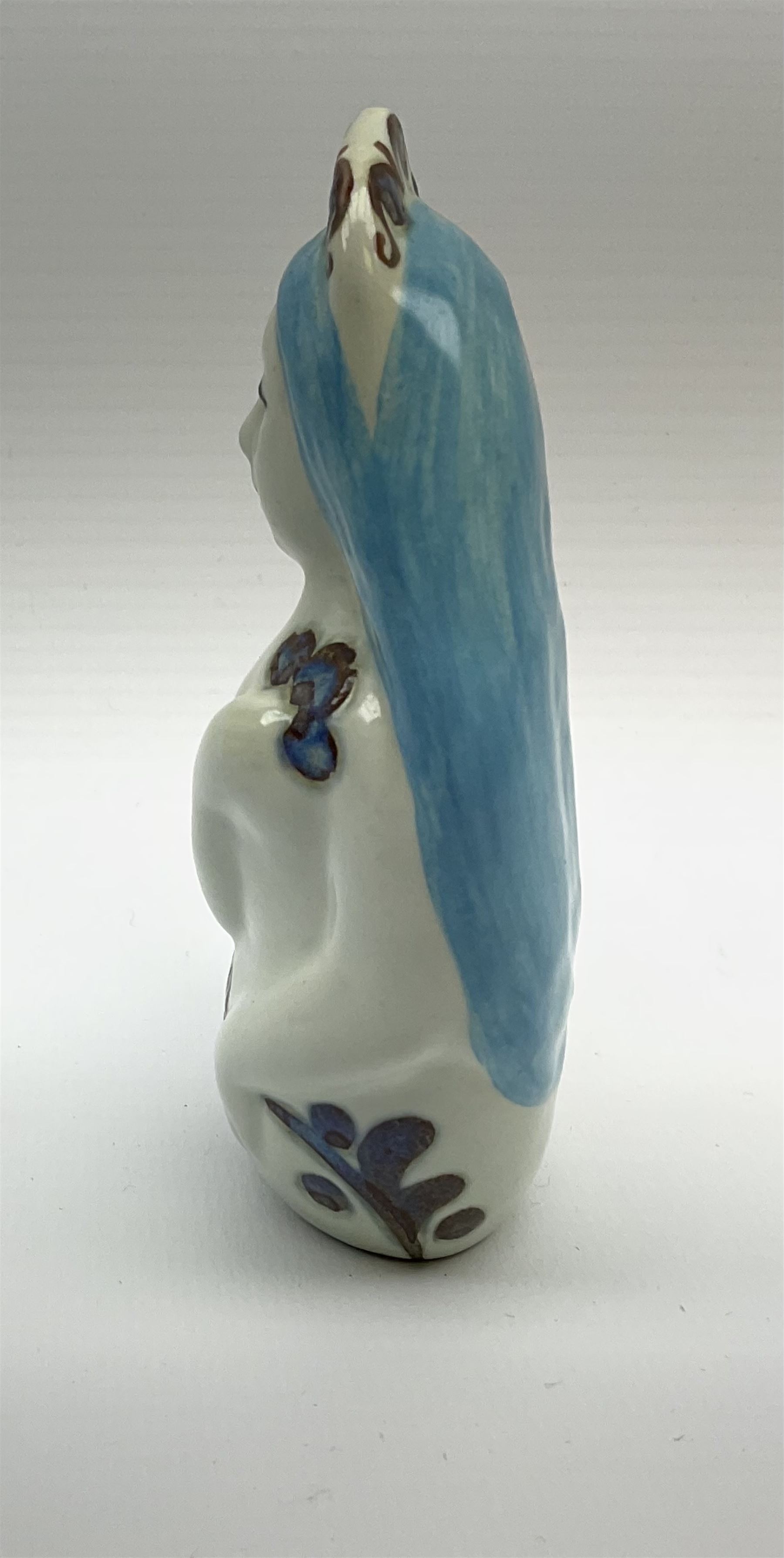 A Doreen Middelboe for Royal Copenhagen Aluminia figure, modelled as a mermaid, with printed and painted marks beneath, H10.5cm.