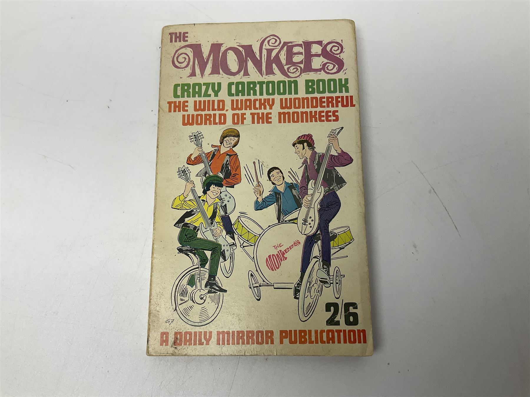 Monkees memorabilia - 'Monkees Monthly' magazine almost complete run from No.1 Feb 67 to No.31 Aug 69 (lacking nos.29 and 32); the cover of No.1 signed by all four members of the group during their 1997 Reunion Tour; quantity of A&BC bubble gum cards; programme for their only UK live performance in 1967 at Empire Pool Wembley; and other related late 1960s music magazines/paperback book