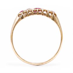 Early 20th century 18ct gold ruby and diamond ring, three round cut rubies, spaced by two old cut diamonds, Chester 1914, 