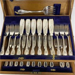 Canteen of silver plated fish knives and forks, with ornate foliate decoration housed in canteen with hinged two tier interior