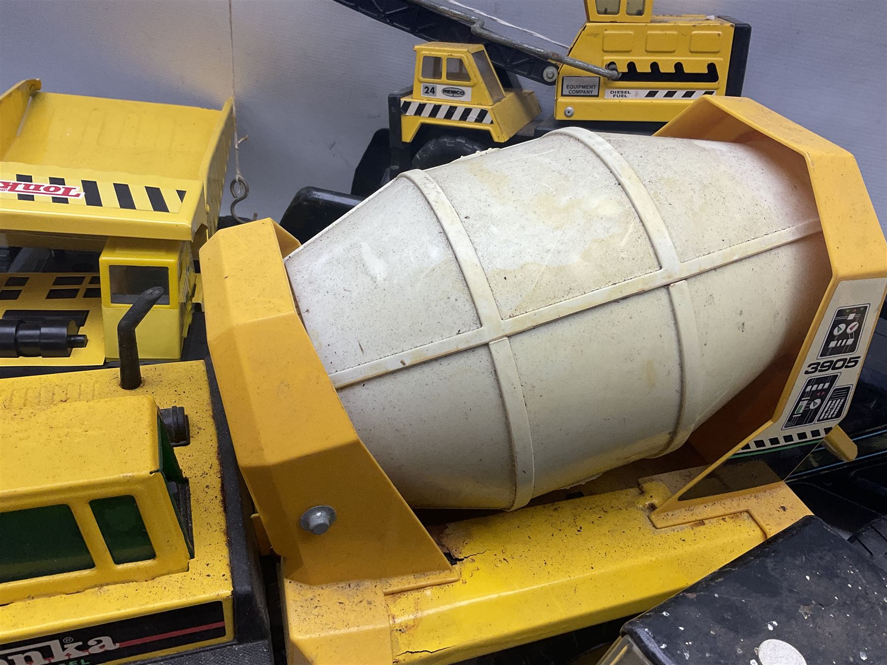 Tonka - five large scale steel pressed vehicles comprising Cement Mixer, Car Transporter, Mobile Crane and two Dumper Trucks (5)
