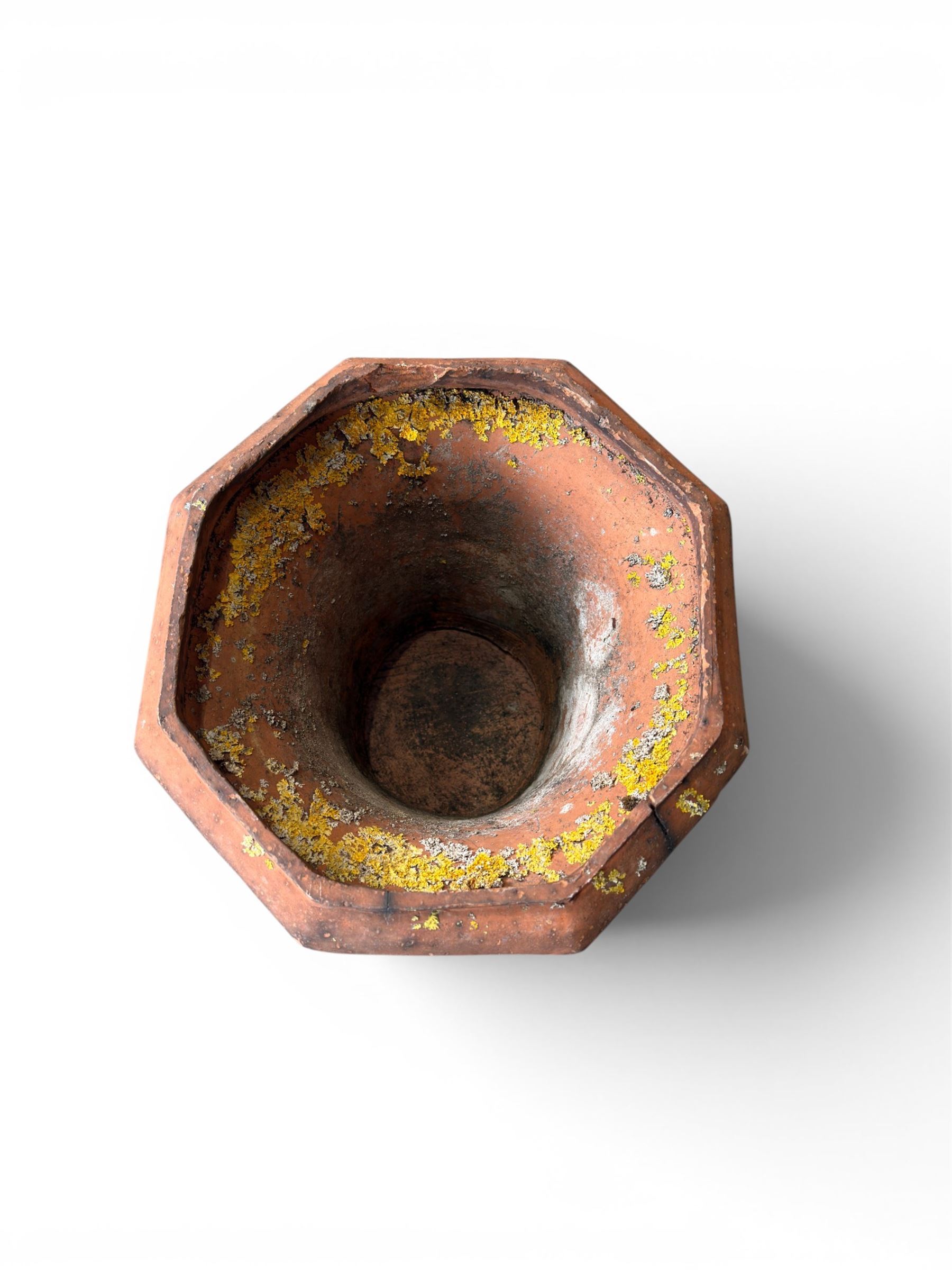 Small 19th century terracotta octagonal planter with stand, flower and leaf design