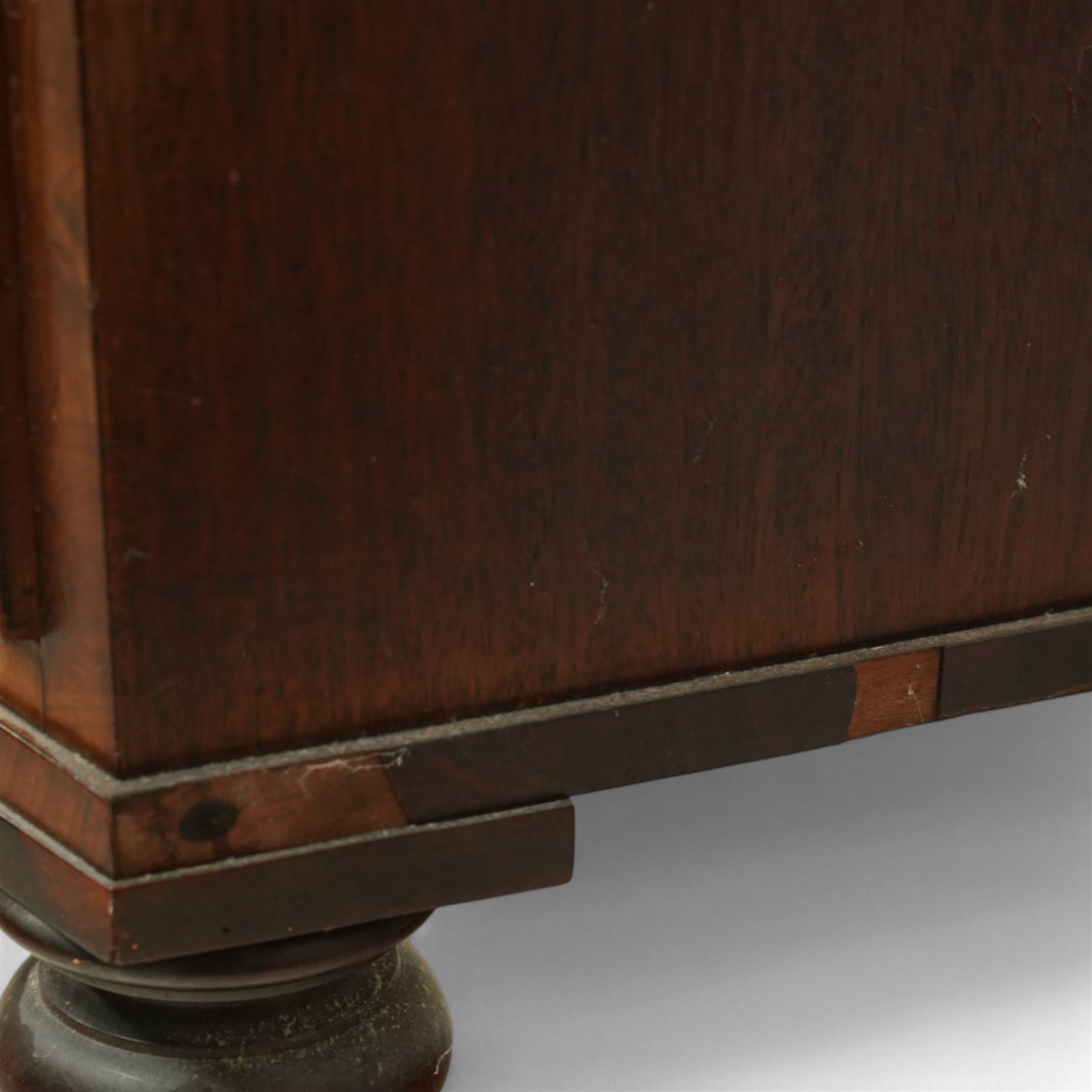 19th century mahogany chest of drawers, bow fronted form with two short over three long drawers, each veneered in matched flame mahogany, on turned feet