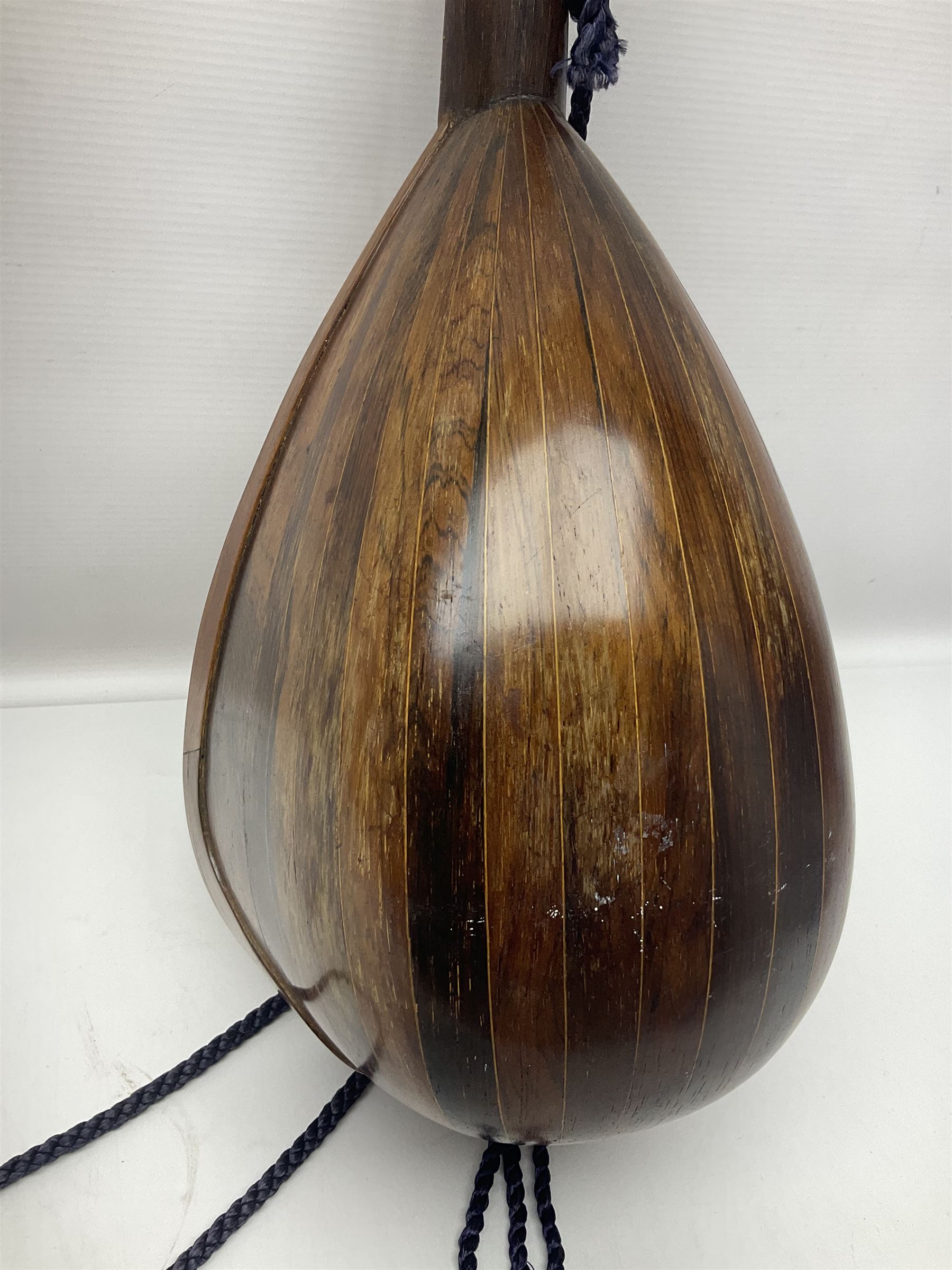 Late 19th/early 20th century Italian lute back mandolin with segmented back and spruce top; bears maker's label for Pietro Tonelli Napoli; together with a mandolin instruction booklet and a folding music stand L60.5cm