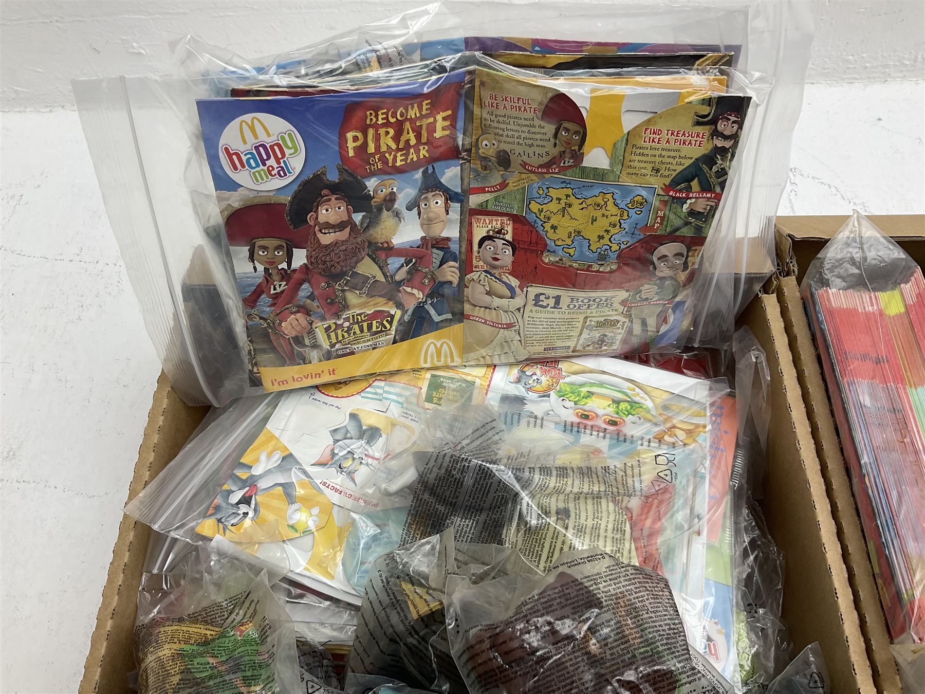 Large quantity of Mcdonalds toys to include The Simpsons in three boxes