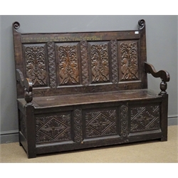  19th century oak bench, floral and mythical creatures carved back panels, hinged seat, scrolled arms with turned supports, panelled front with gothic style lozenge and guilloche carvings, stile supports, painted on top rail 'John Cousin, Old Town Hall, Wandsworh', W140cm, H120cm, D56cm  