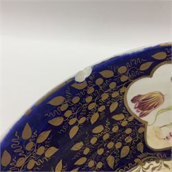 19th century continental bowl, decorated with hand painted floral sprays amongst gilt foliate decoration on a cobalt blue ground, D27.5cm