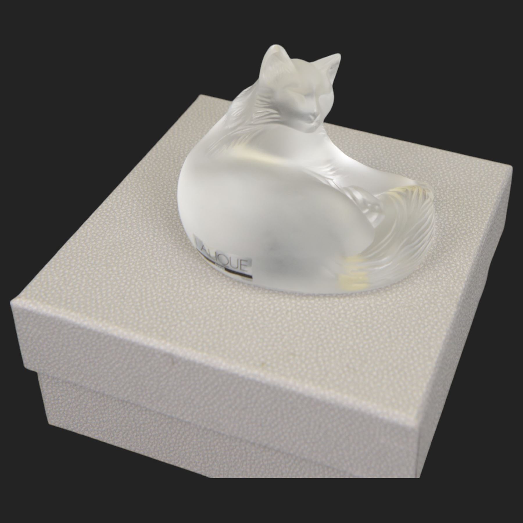 Lalique glass cat in recumbent pose, signed to base, with original box, H3cm