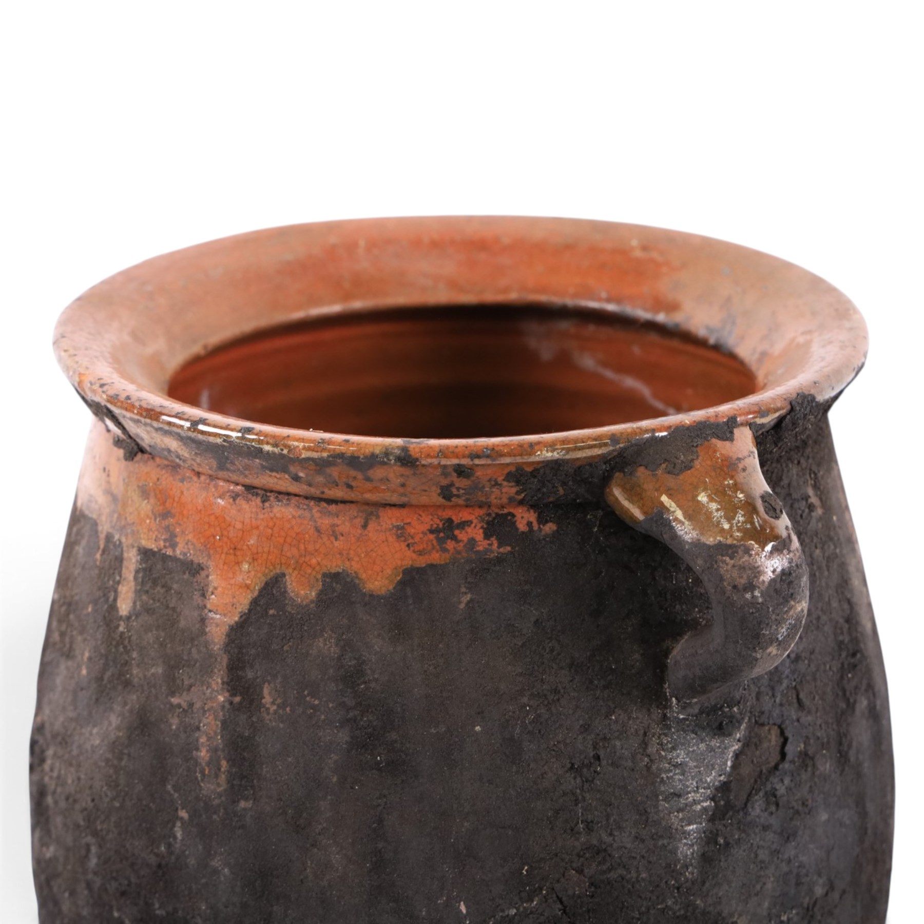 Spanish twin handled cooking pot, blackened to the outside, together with two bowls with slipware glaze, pot H22cm 