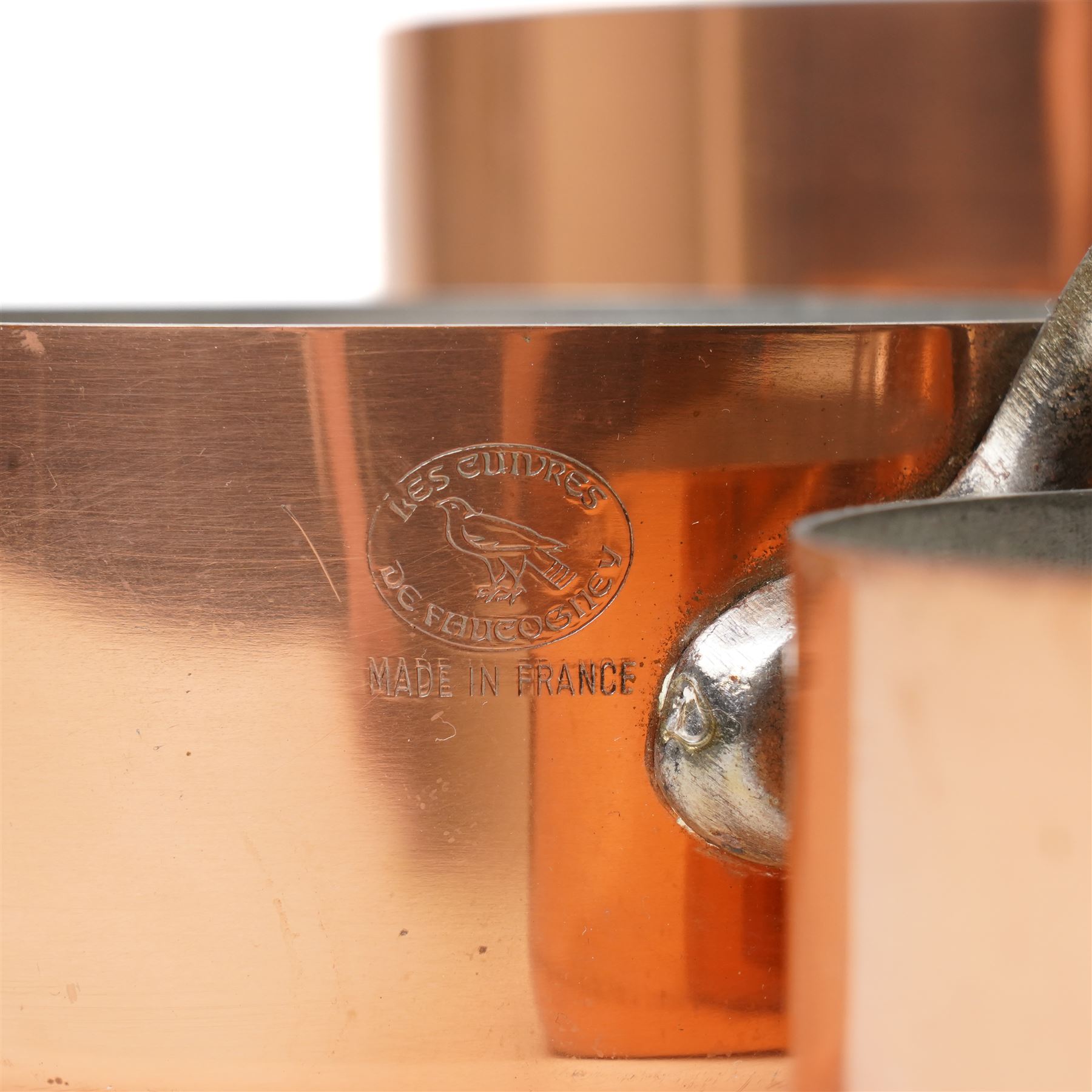 Set of five French copper graduating saucepans with iron handles, stamped Les Cuivres de Faucoeney, max D18cm