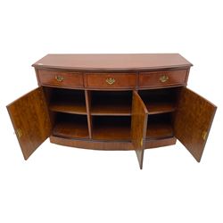 Georgian design walnut bow front sideboard, fitted with three drawers and cupboards