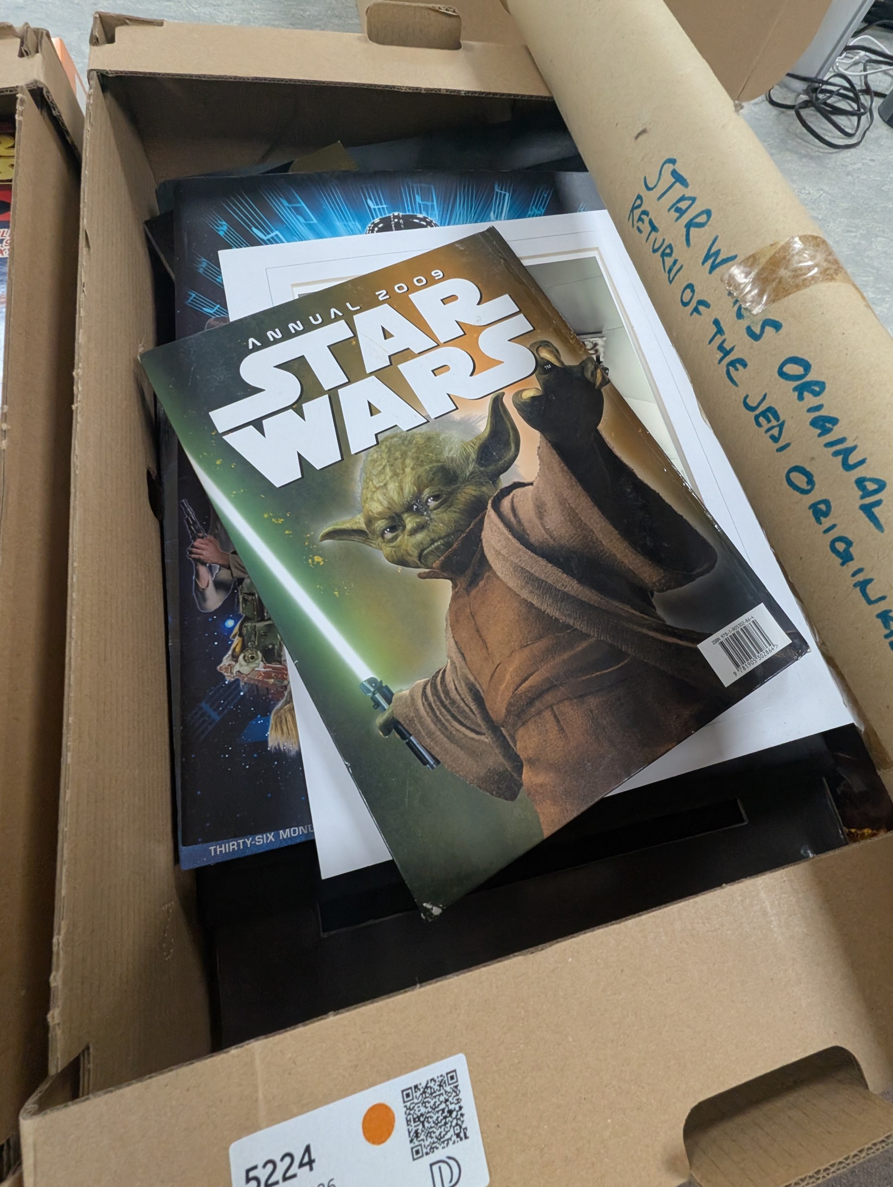 Star Wars collectables, including Mandalorian helmet, Topps foil caps, plastic cups, mug, figures, Masterworks Movie collection, Return of the Jedi Poster, magnets, watch, etc,in three boxes