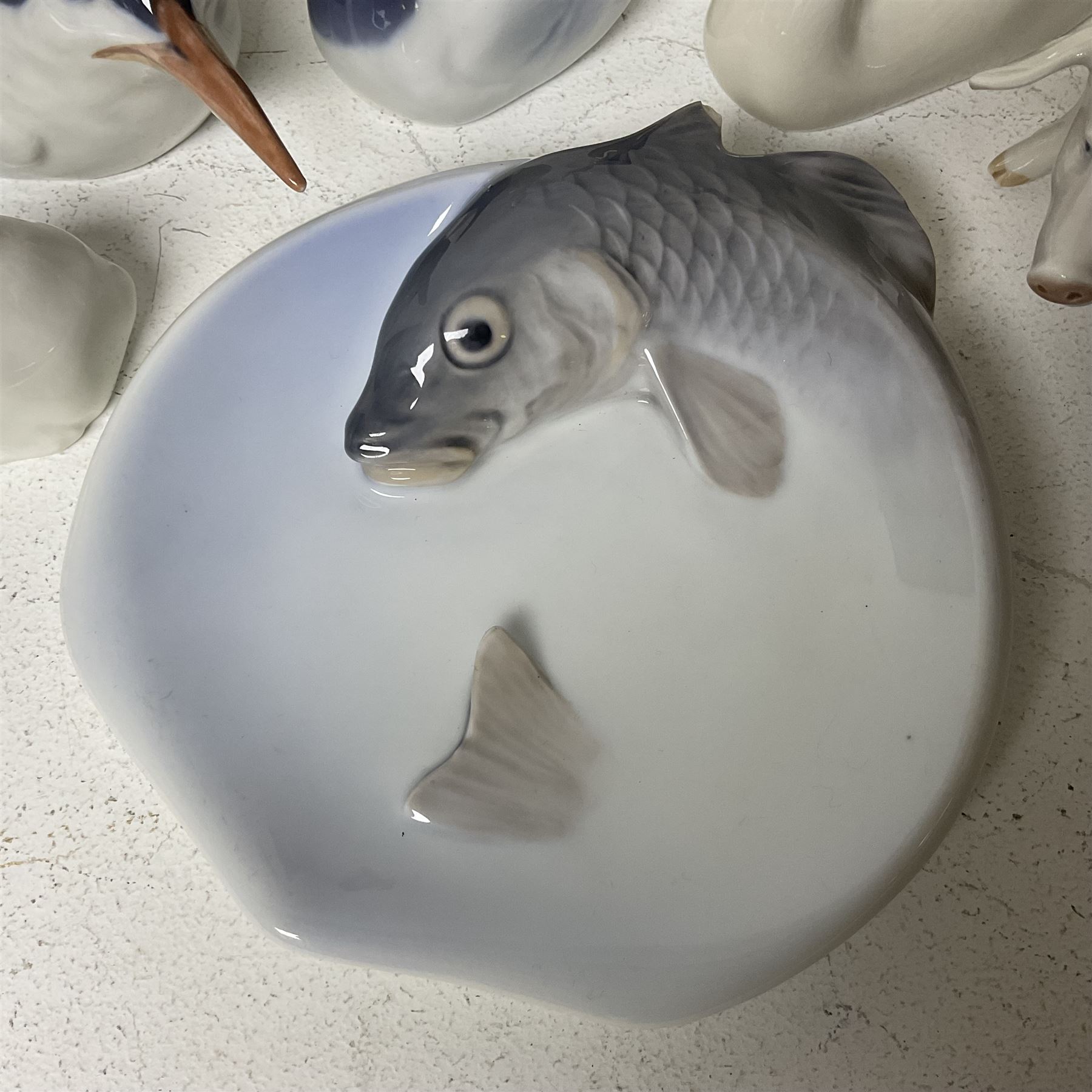 Seven Royal Copenhagen figures, including Arctic tern no 827, Swan no 755, Kingfisher no 2257 etc, together with Royal Copenhagen dish