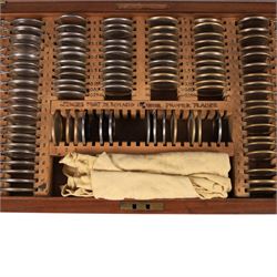 Holborn Surgical Instrument Co. Ltd set of opticians testing lenses, in fitted wooden box