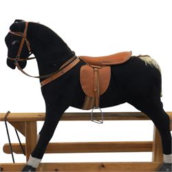 Vintage rocking horse on pine trestle base, early to mid 20th century