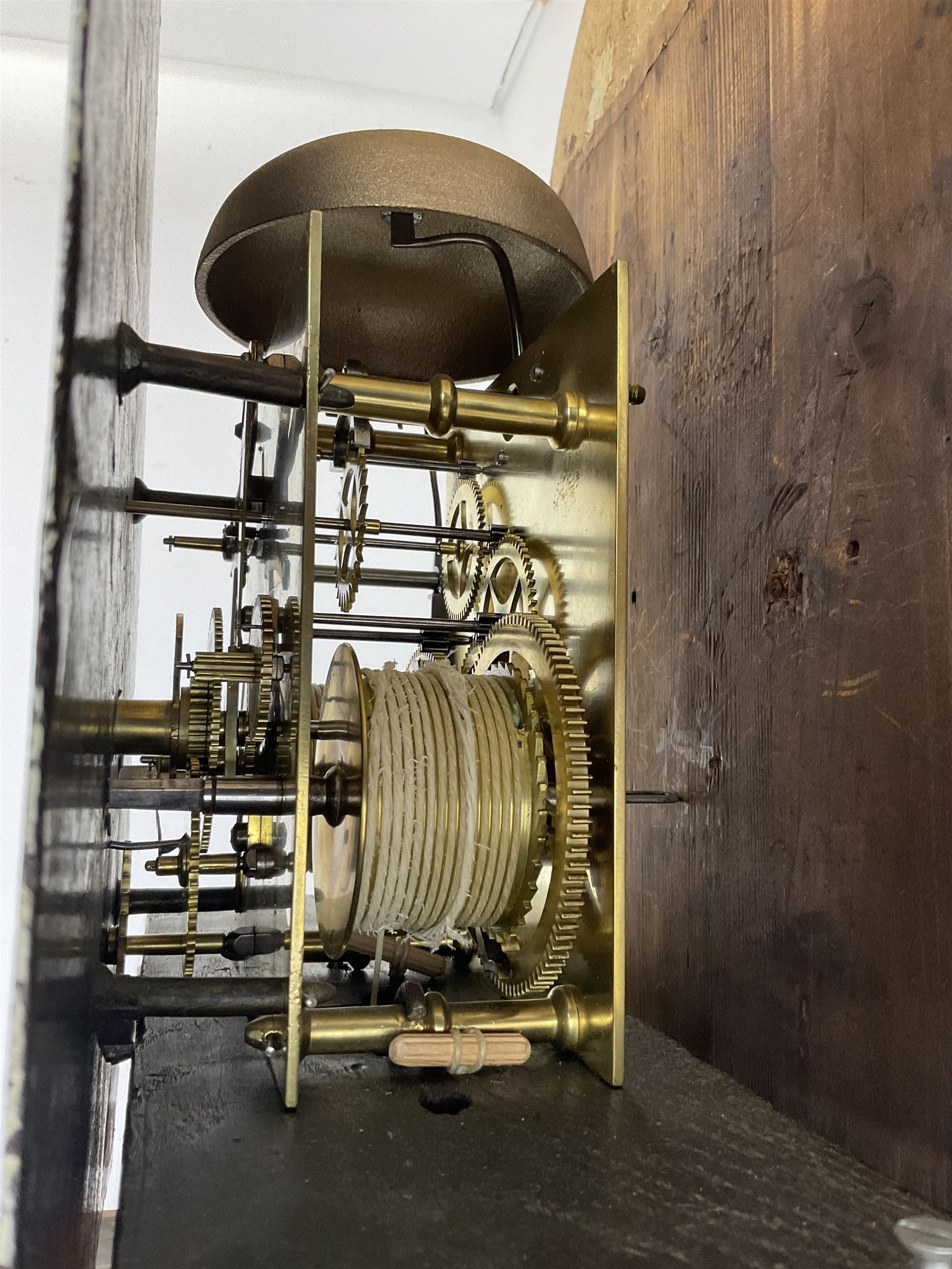 G Fortier of Sittingborn - Early 19th century 8-day mahogany longcase clock c1825, with a break arch pediment and hood door flanked by reeded pilasters with brass capitals, plain case with a long trunk door with a conforming break arch top, plinth with applied skirting, painted dial with upright Arabic numerals, date  and seconds dials, floral spandrels and a rural depiction of a country house and river to the arch, replacement steel hands with brass pointers to the calendar and seconds dials, dial pinned directly to a rack striking movement. With weights, pendulum and winding key.