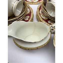 Royal Albert Lady Hamilton pattern tea service comprising twelve tea cups, eleven saucers, twelve tea plates, two serving plates, sugar bowl and milk jug