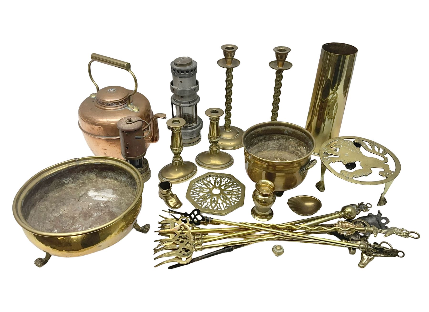 Collection of brassware, to include two jardinieres, candle sticks, brass shell, etc