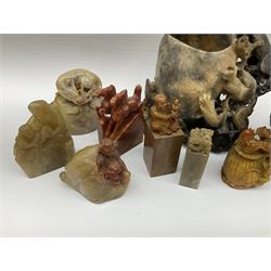 Quantity of carved soapstone figural seals to include examples with foo dogs, mythical dragons, horses, and tortoises, together with a carved soapstone monkey with open pot etc, tallest H14.5cm, (18)