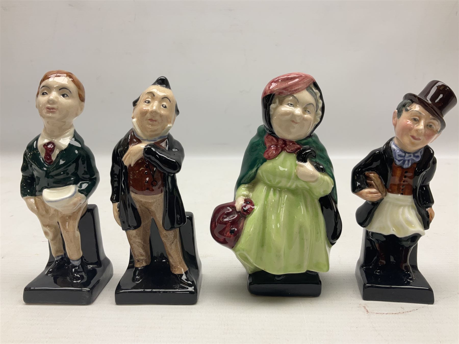 Sixteen Royal Doulton Charles Dickens figures, to include Oliver Twist, Fat Boy, Fagan, Stiggins etc, all with printed marks beneath